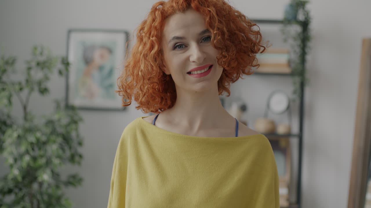 Woman with Red Curly Hair Smiling