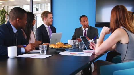 Business-colleagues-talking-at-a-meeting