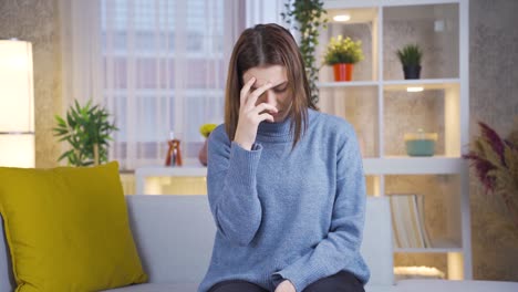 sad thoughtful young woman feeling unwell at home and demotivating.