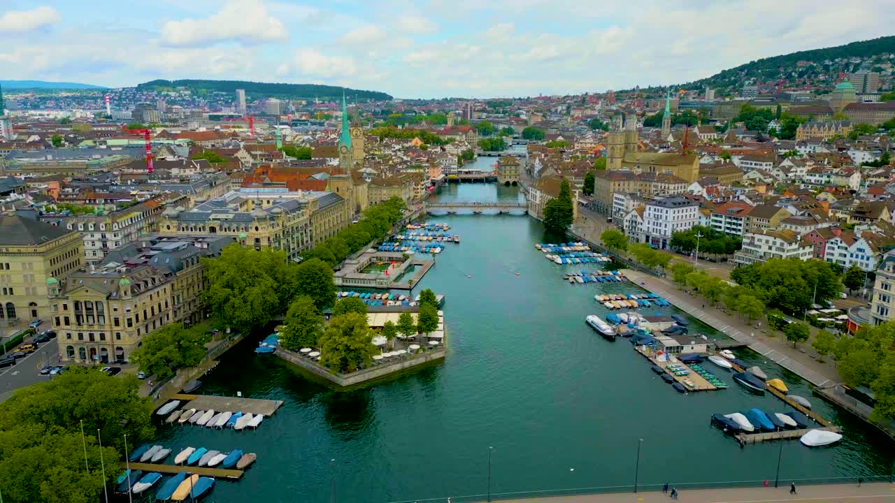 4K Drone Video of the Münsterbrücke and Rathausbrücke Bridges over the Limmat River in Downtown Zurich, Switzerland