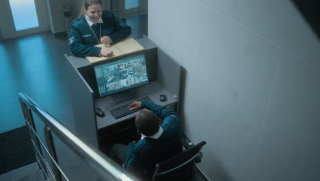 security personnel discussing at reception desk