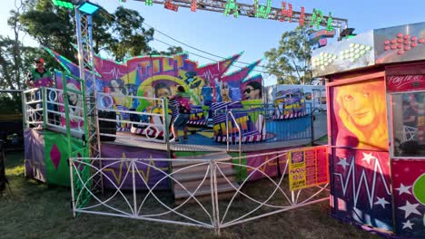 colorful amusement ride with people enjoying