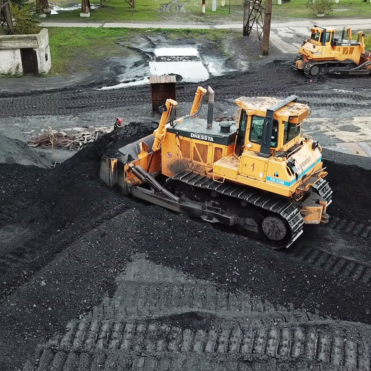 Crawler bulldozer works on coal mines. Energy for thermal power plants. Industry