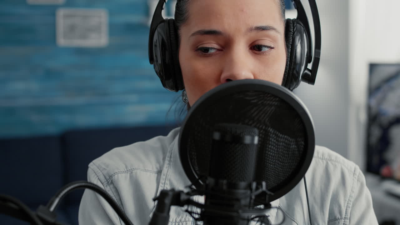 Online live radio talk show host filming remote podcast while talking to public at home studio desk