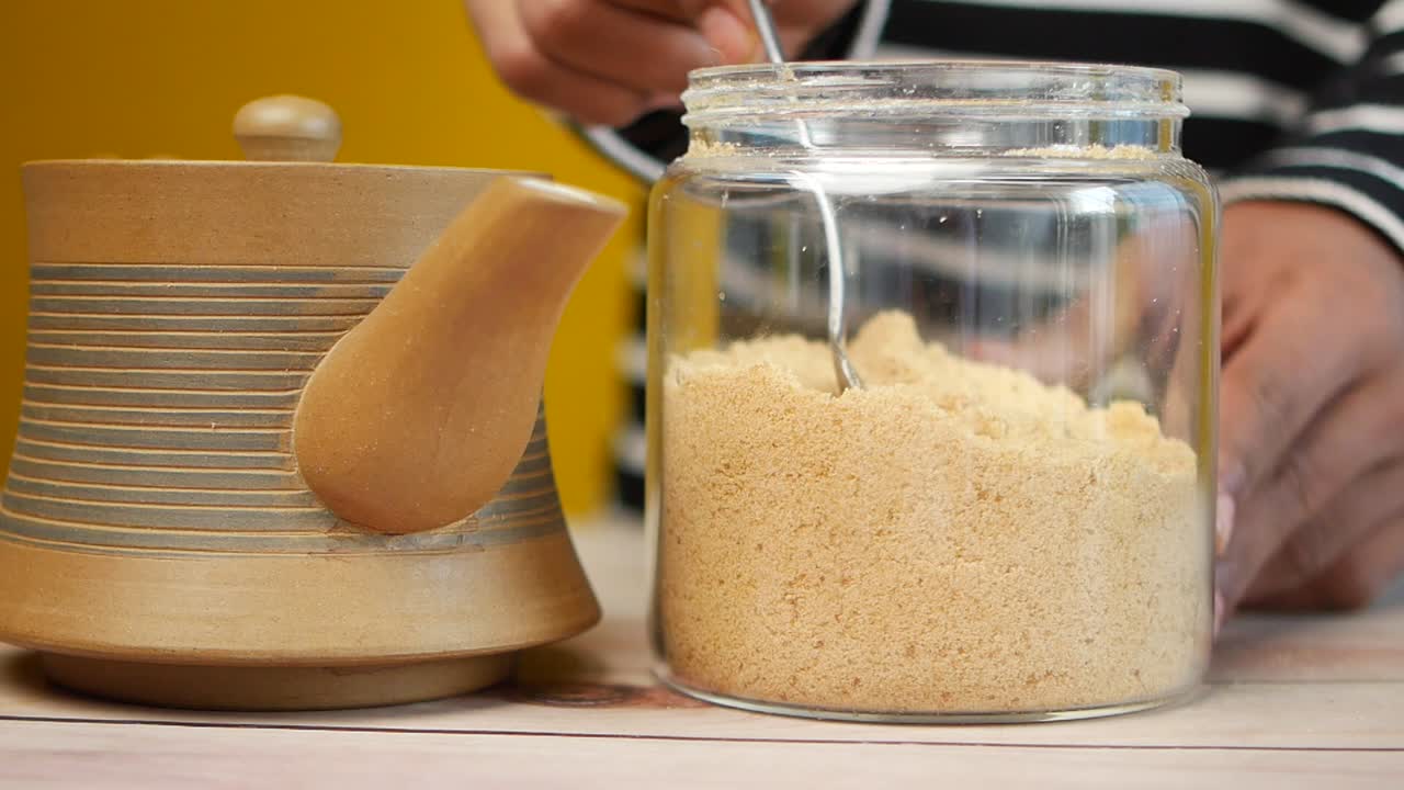 Scooping Powder from a Jar