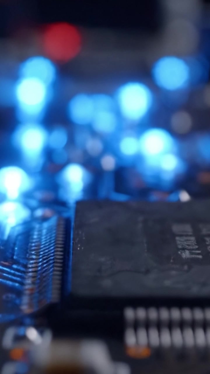 Close-Up of a Circuit Board with Glowing Blue LEDs, Showcasing Intricate Electronic Components and Connections in a High-Tech Environment