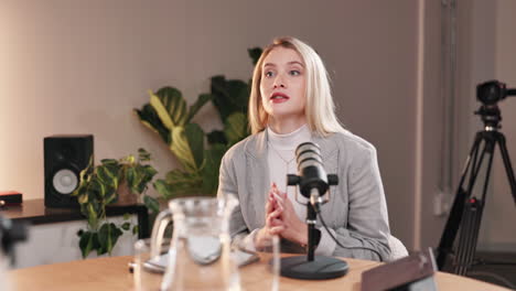a woman recording a podcast