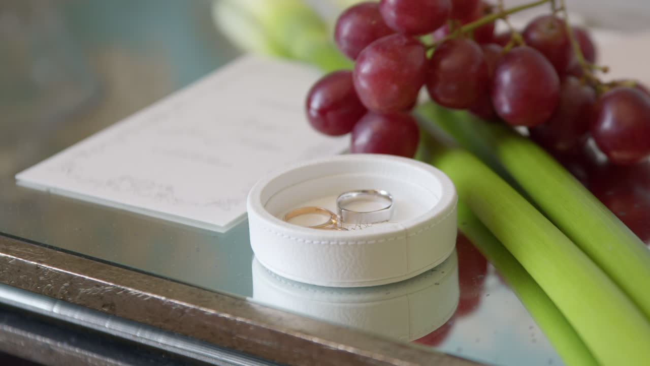 Wedding Rings On A Customized White Circle Box. Close-up Shot