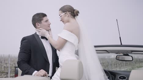 couple in convertible on their wedding day