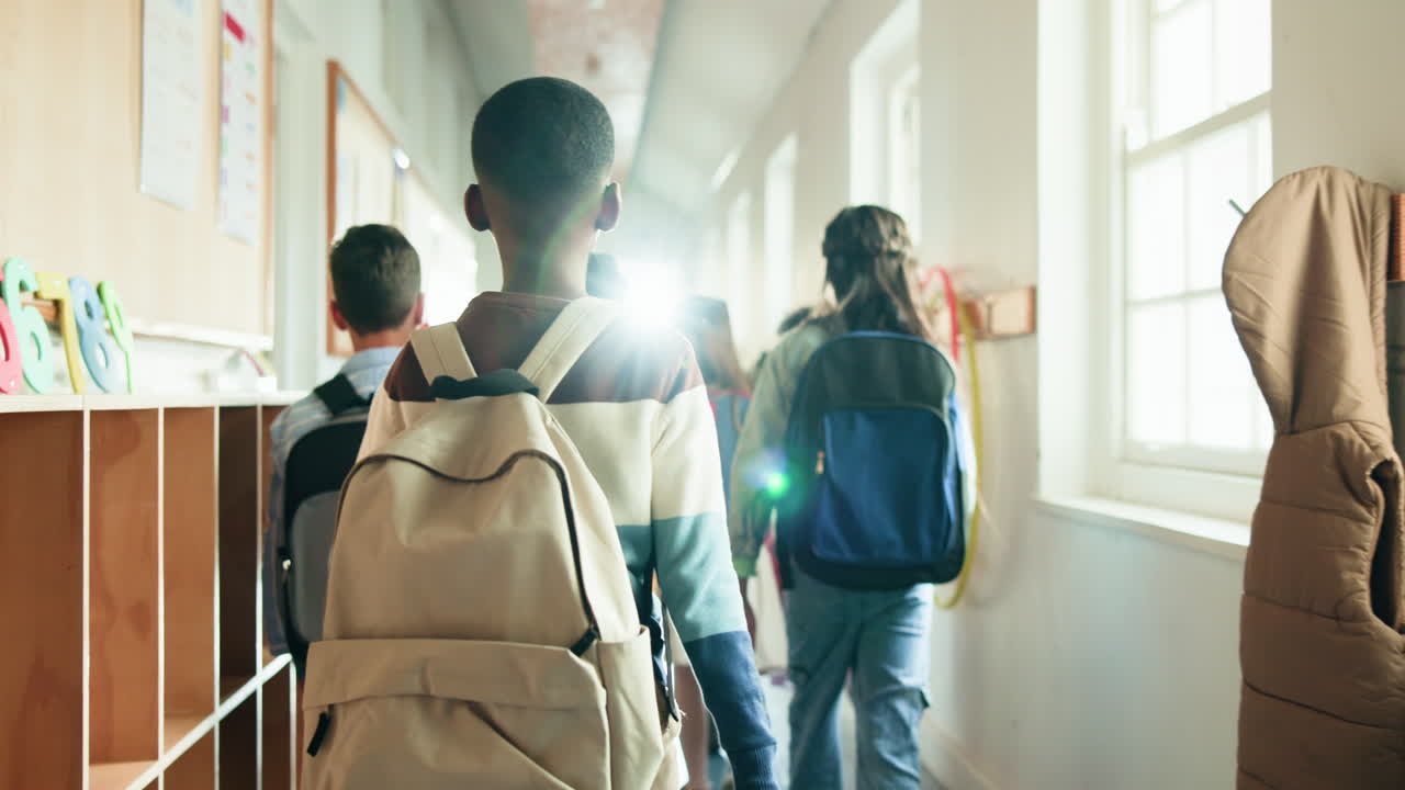 Students walking down a school hallway