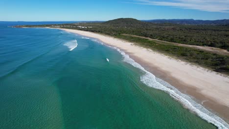 picturesque view of maggies beach, cabarita, northern rivers, tweed shire, bogangar, new south wales, australia, aerial pull back