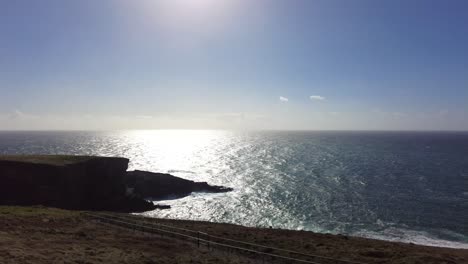 Scenic-shot-of-the-cliffs-and-rocks-at-Mizen-Head-South-West-Ireland-on-a-beautiful-sunny-day