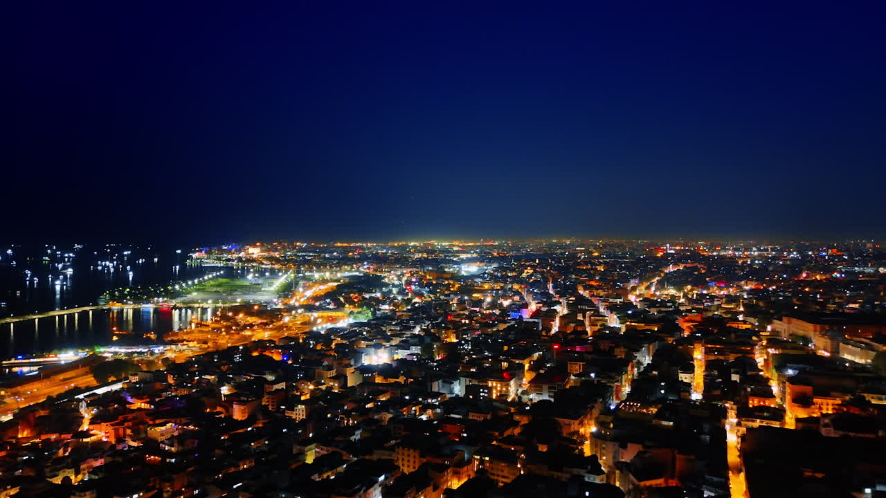 Footage over the urban area of Istanbul lit with street lights. View on Turkey capital at night