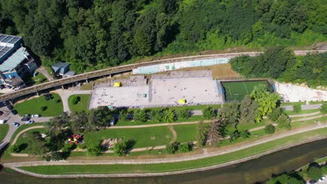 aerial view of a park with sports fields and playground