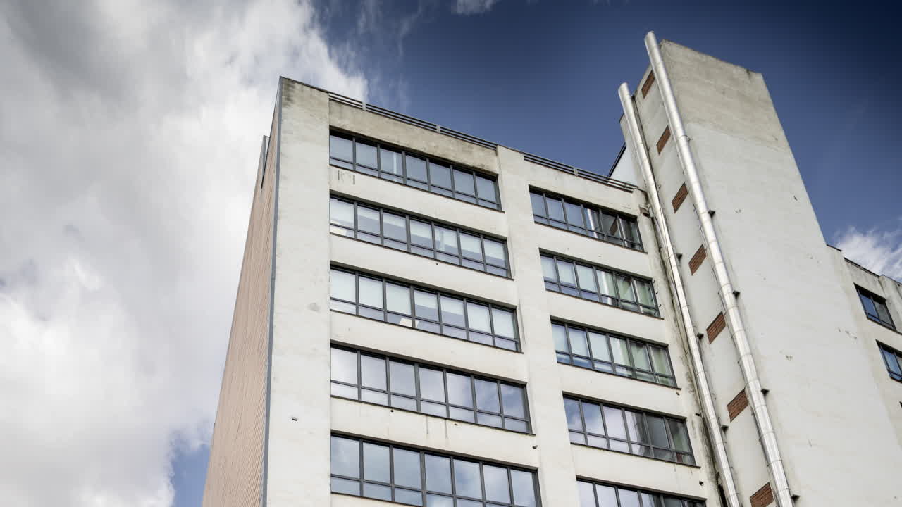 Old factory and industrial complex with passing clouds