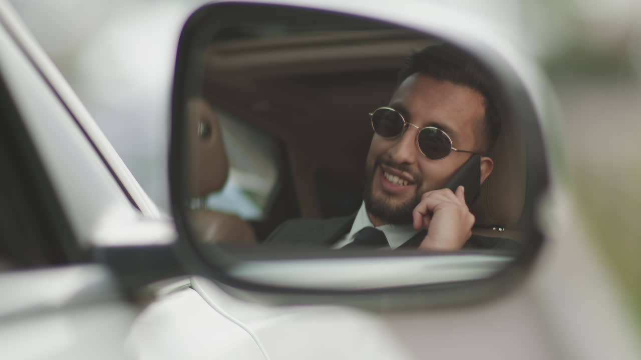 Reflection of Mixed-Race Man in Side Mirror