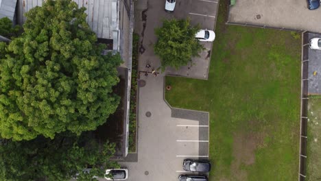 Rusty-rooftop-of-old-church-in-Riga-city,-aerial-top-down-view