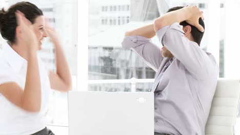 jolly business team working at a computer