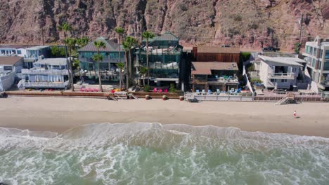 aerial 4k footage of beach houses on the coast of malibu, california, usa