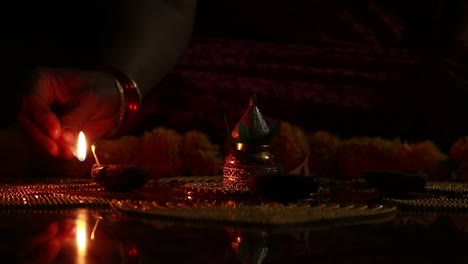 lighting up mud lamps for the festival in india