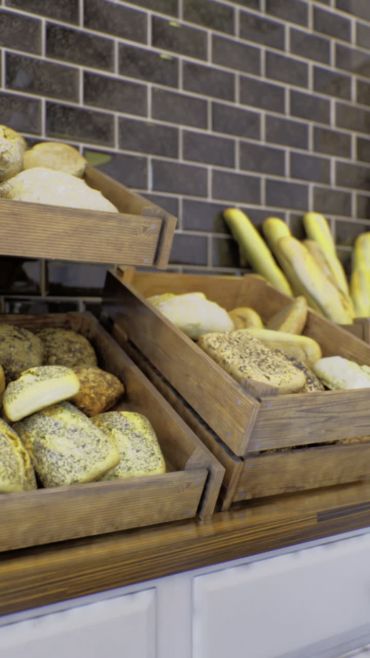 Freshly baked loaves and artisanal bread displayed in rustic wooden crates