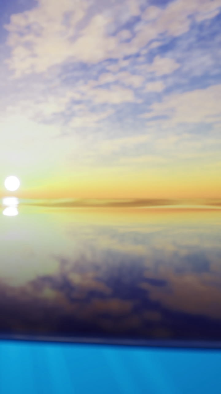 Sunset over calm water with reflections and colorful sky in the evening
