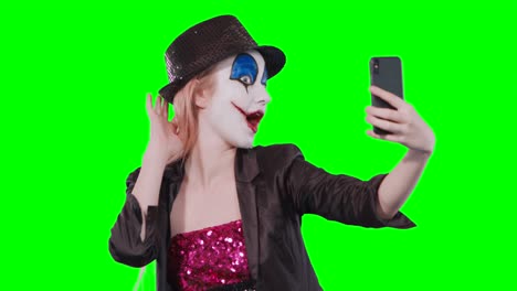 halloween clown make-up taking a selfie mobile phone