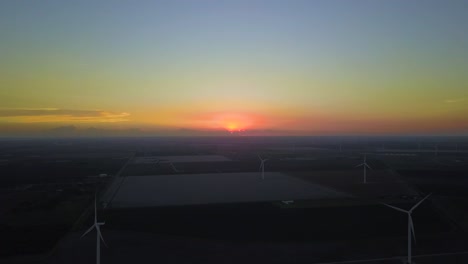 texas sunset over a windfarm in texas