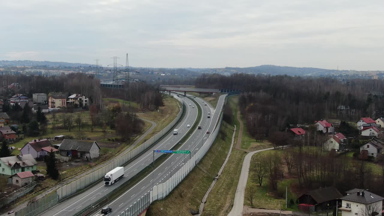Cars and Trucks Traffic Flow on Poland's A4 Highway with Sound Barriers