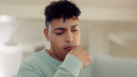 young man, thinking and laptop in home office