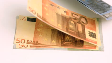 wind blowing in super slow motion on euro banknotes