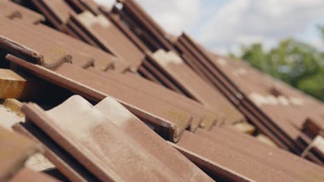 Roof-tiles-prepared-to-be-placed-in-by-roof-worker,-motion-view