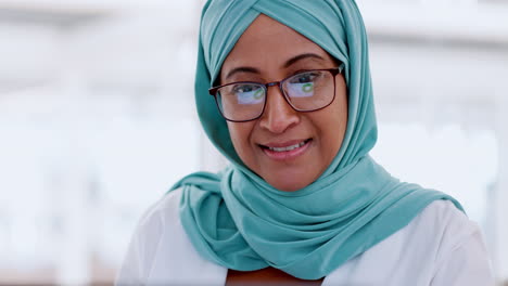 Muslim-business-woman,-face-and-working-at-laptop