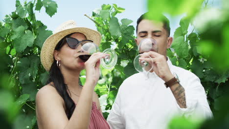 a young couple out on a date at a vineyard