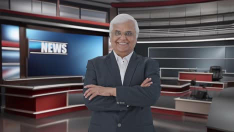 happy indian senior journalist standing crossed hands