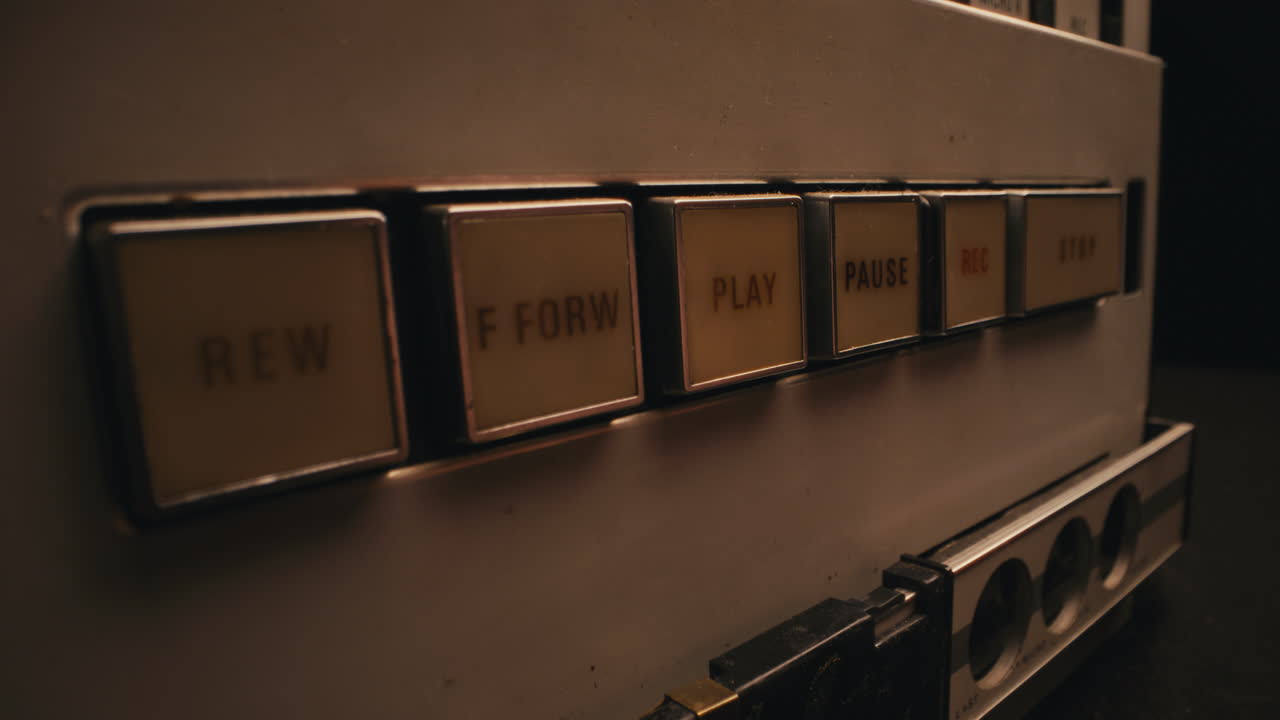 A vintage tape recorder in a blinking light