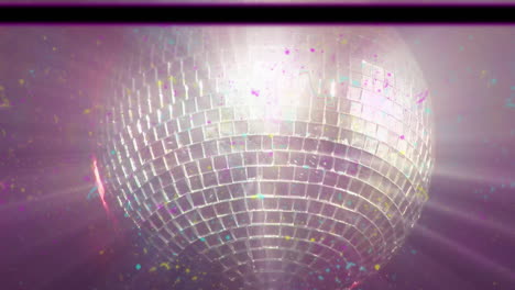 animation of distressed vintage film showing glowing disco mirror ball spinning