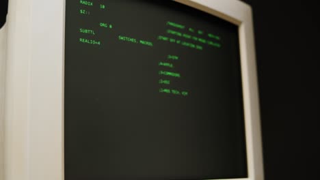 Vintage Computer Monitor Displaying Code