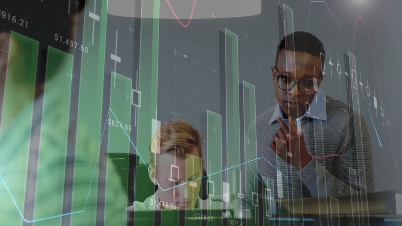 office team collaborating around desk, overlaying green finance bar graphs and candlestick charts