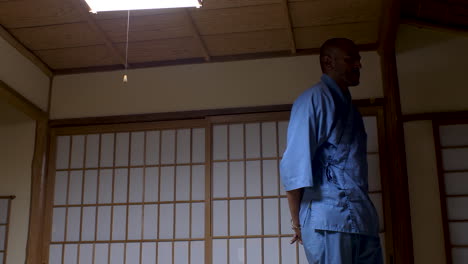 a person paces back and forth within the serene ambiance of a traditional japanese home, reflecting the concept of contemplation and mindfulness in a tranquil setting