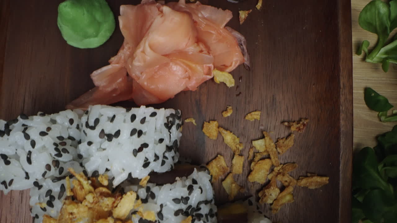 Sushi with sesame seeds and fried onions