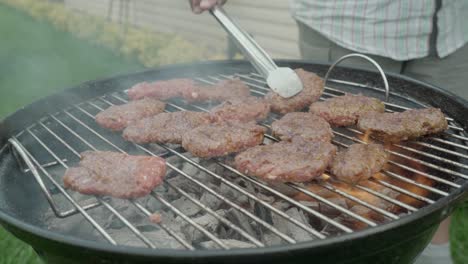 turkish minced meat also known as meatball or kofte is being cooked on a grill with smoke