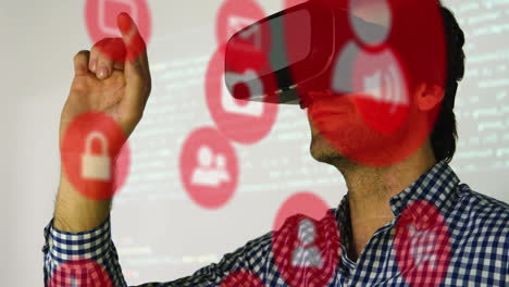 multiple red digital icons against caucasian man wearing a vr headset at office