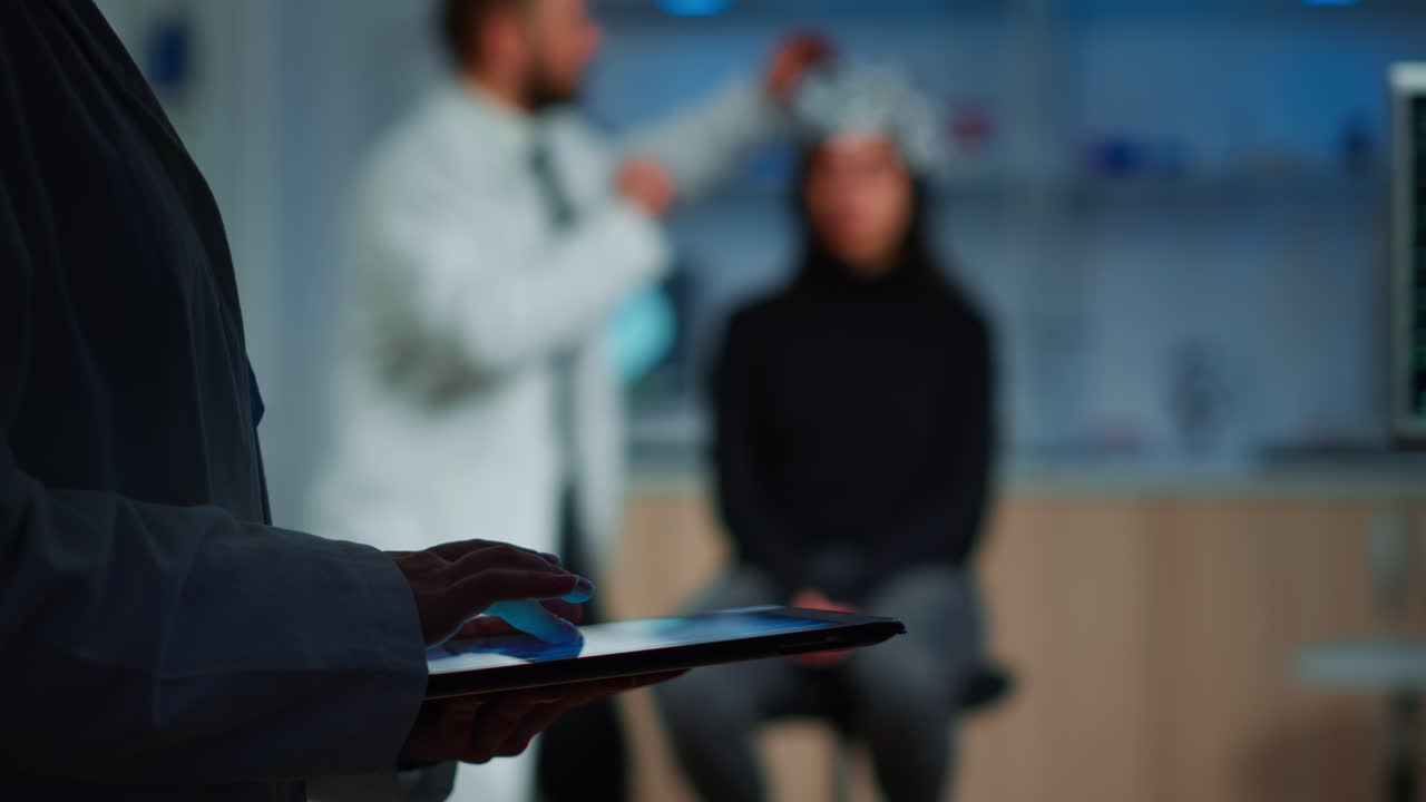 Close up of scientist in neurological dysfunctions working at tablet