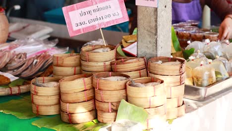 bamboo baskets and food at a market stall