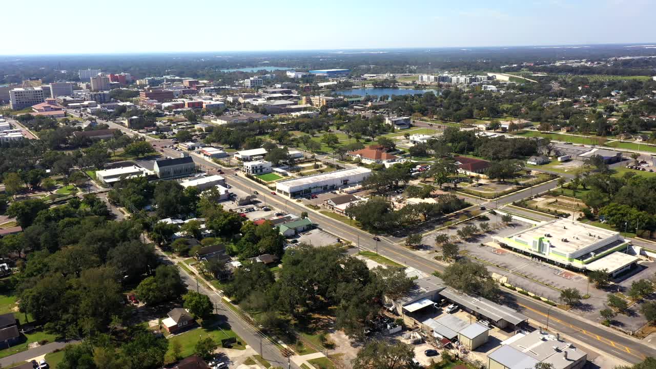 Aerial orbit of central Winter Haven with business blocks and small town charm
