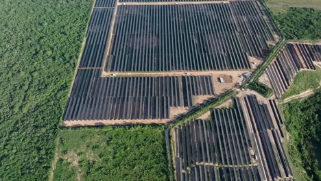 Aerial-birds-eye-shot-over-photovoltaic-park-in-La-Romana-during-sunny-day,-Dominican-Republic