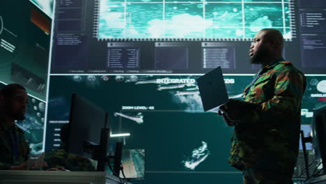 military officer oversees surveillance and cybersecurity operations