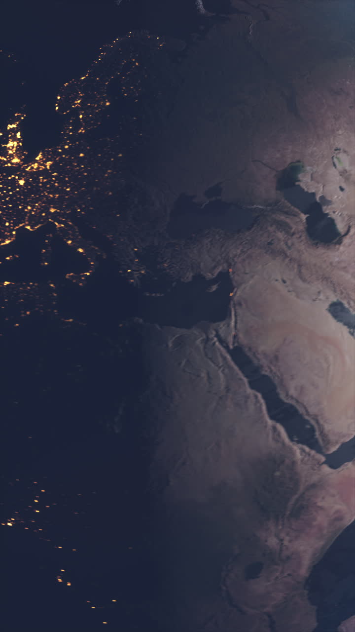Vertical Video View from Space of Asia and Europe Continents with City Lights Visible as Earth Rotates Transitioning from Day to Night. Science Space Footage Idea for Adding to Social Media Videos.