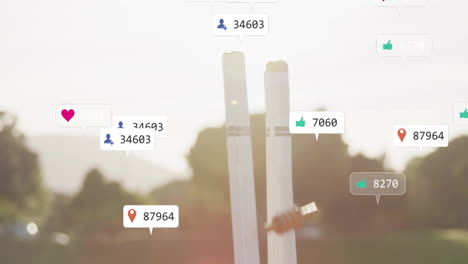 animation of icons and data processing over caucasian male cricket player